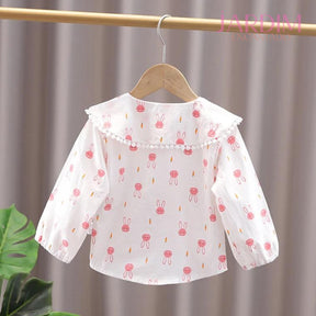 Blusa feminina infantil Blusa infantil com babado Blusa com estampa de coelho Roupas infantis algodão e poliéster Blusa de algodão e poliéster Blusa com babado e coelho Roupa feminina infantil estampa coelho Blusa infantil fofa Blusa com estampa animal Moda infantil blusa coelho